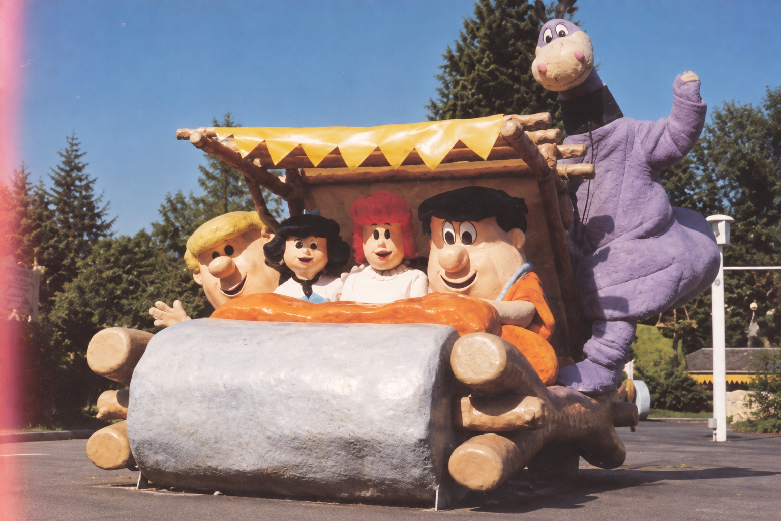 AI-generated illustration of Flintstones characters in a stone car, inspired by Bedrock City.